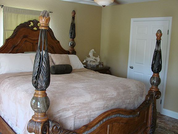Huge masterbedroom, this is a KING size poster bed with room to spare!