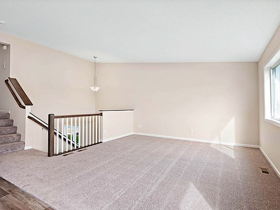 Enjoy comfortable living and entertaining areas on the upper level of this home.