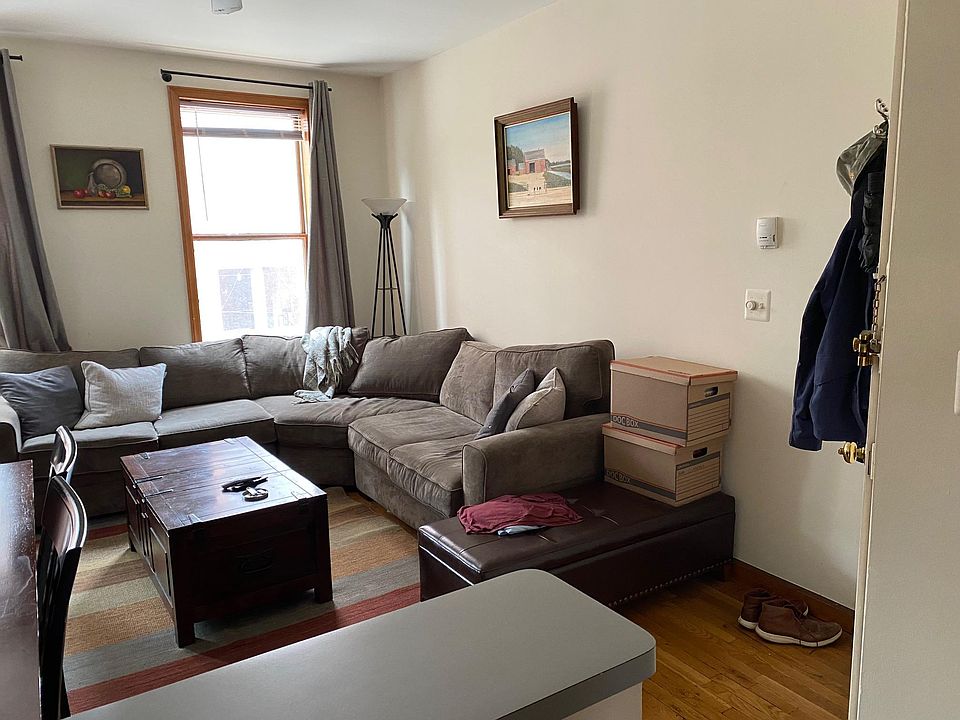 Living area w hardwood floors and ceiling fan