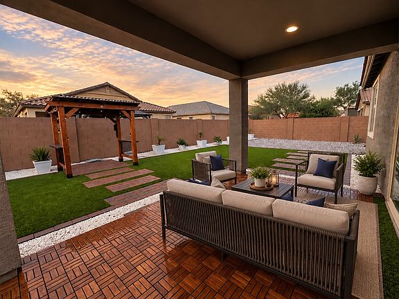 Cover the patio floor with wood and add a gazebo area with exterior furniture.