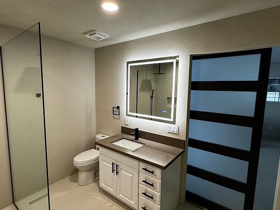 NEW LED Mirror and LED Lights and Quartz Countertop. New Black Delta Faucet