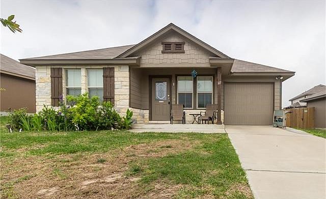 Adorable DR Horton home with shaker shingles and stone accents!!