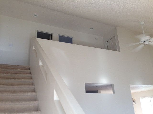 Open stairway overlooks living room