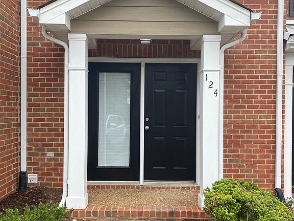 Front Door Featuring Large Side Window for Added Light.