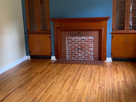 Spacious living room with custom built-ins.