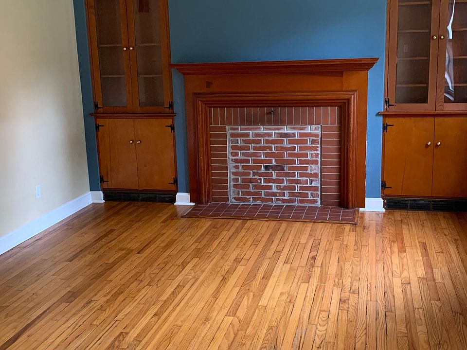 Spacious living room with custom built-ins.