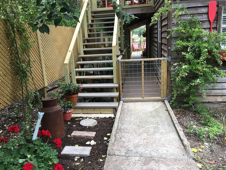 wide stairway entry to upper duplex and deck