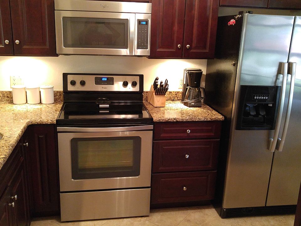 Ss appliances cherry cabinet