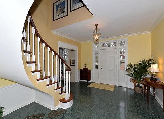 Entry foyer with side and transom glass around front door.
