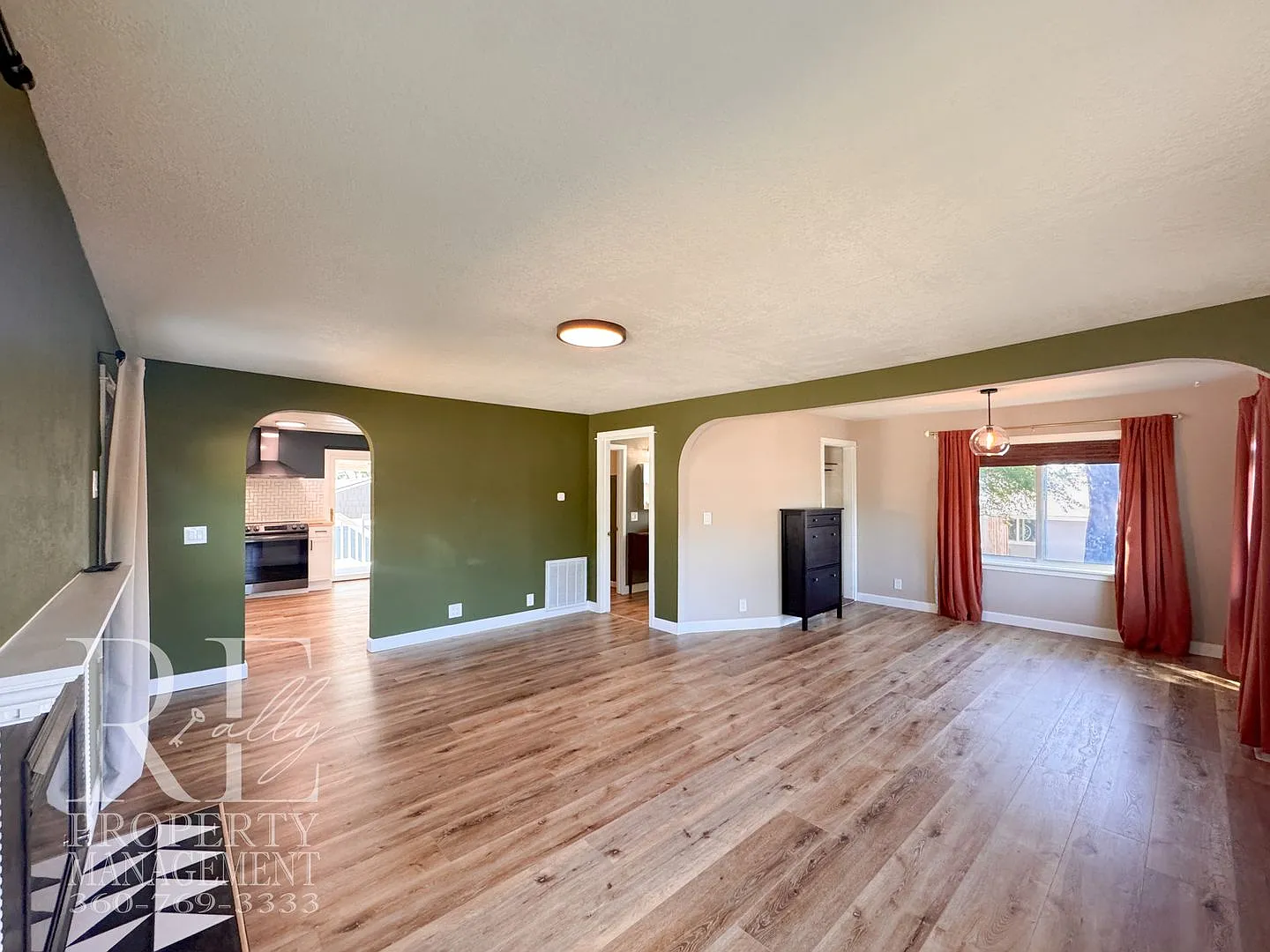 Updated 3-Bedroom Home with Fireplace, Covered Deck & Large Garage — Photo 3