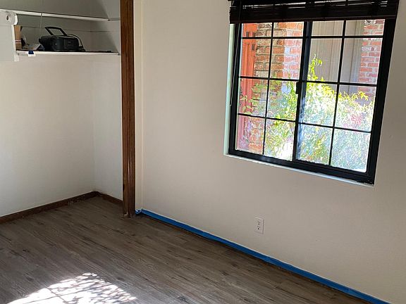 Inside right corner view of window and Hide away closet doorless. Doors are re-attachable.