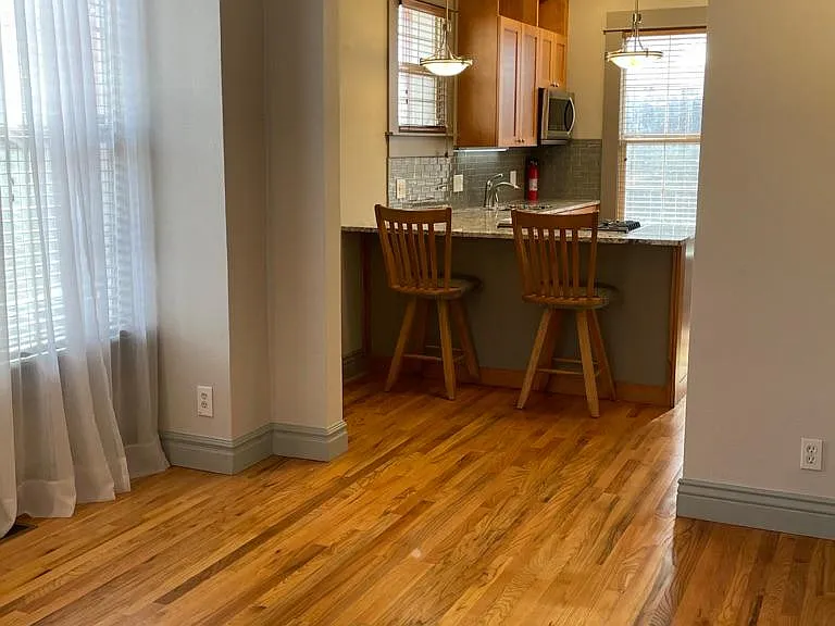 View from Living Room into Dining Area and Kitchen