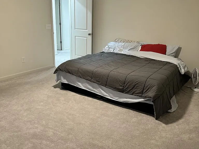 Master bedroom featuring a stunning lake view, where each morning begins with a warm, welcoming sunrise.