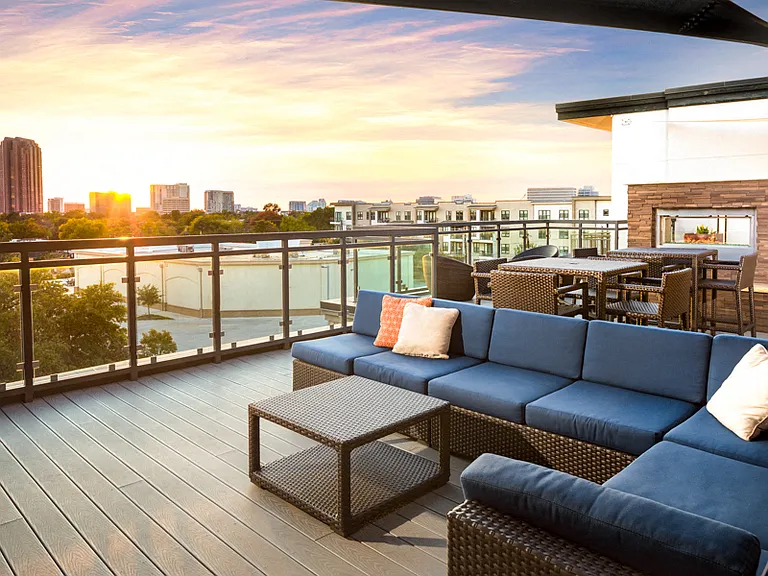Rooftop terrace with outdoor fireplace and TVs