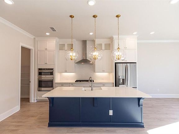 The island will be Ebony and have a single stainless bowl. Matte black gold faucet and gold pulls f