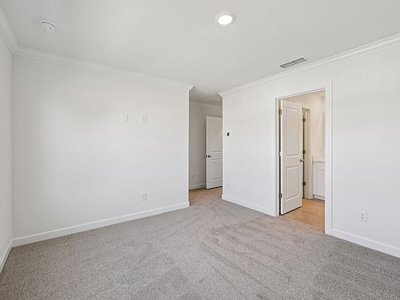 The primary bedroom leads to your own personal ensuite.