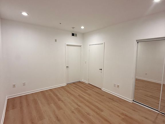 Bedroom # with sliding mirror doors for closet and master bathroom