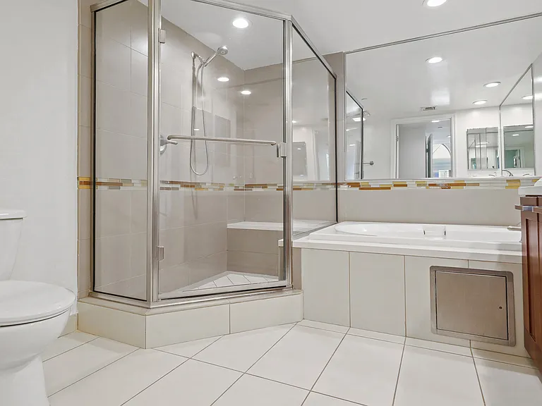 Spacious Master Bathroom with Bathtub and a Walk-In Shower