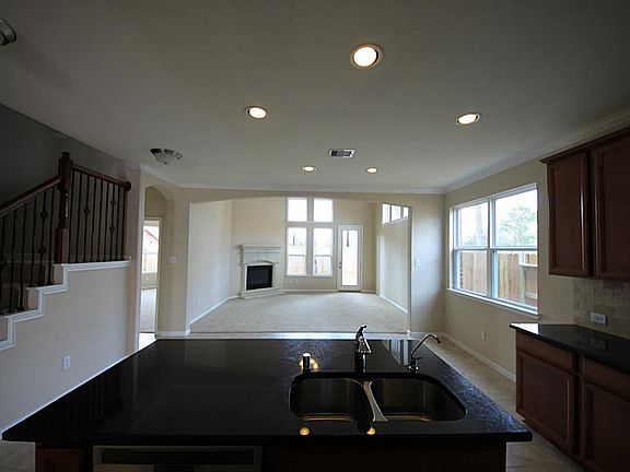 Large island kitchen is open to den