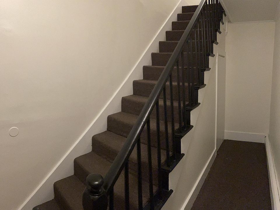 Private hall closet and access to upstairs bedrooms.