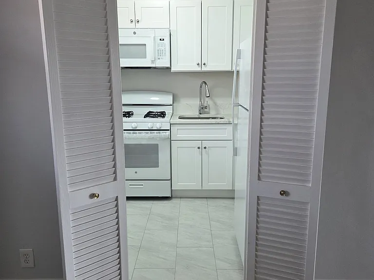 Renovated kitchen off dining area