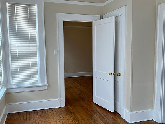 2nd Bedroom #2 view. Forward doorway leads into larger bedroom. Right doorway leads into kitchen.