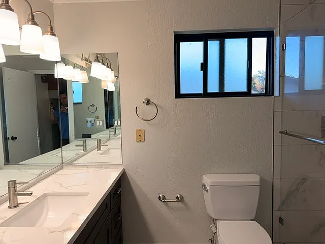 Newly remodeled bathroom. All windows in the unit are double-paned and brand new Milgard aluminum frame windows.