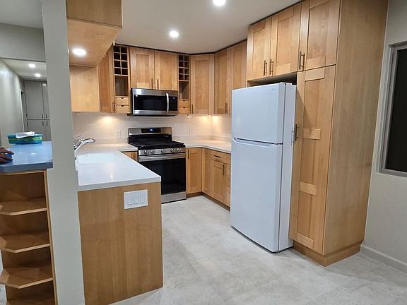 Kitchen. Refrigerator, dishwasher, and microwave are new. Range was installed less than 1 year ago.