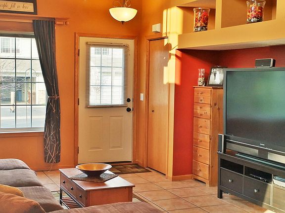 Large living room with tile flooring.