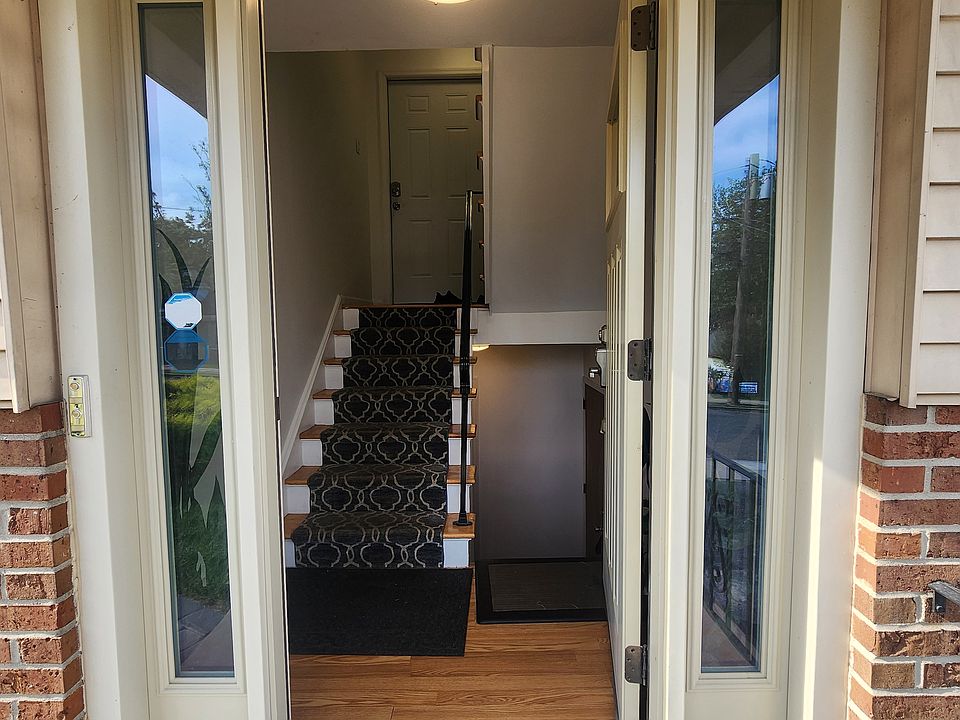 Main Entrance + Stairway to the Garage and Washer/Dryer