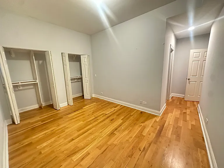 Master bedroom with adjacent bathroom