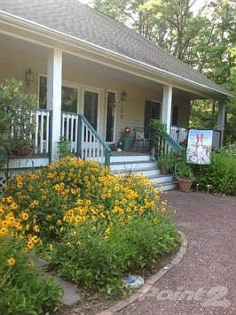 With wildflower gardens galore