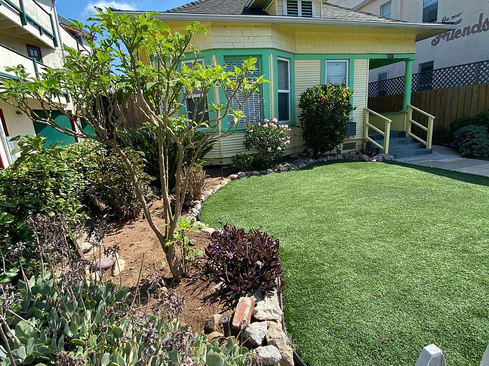 Front Of the House With Artificial Turf and Succulent Gardens