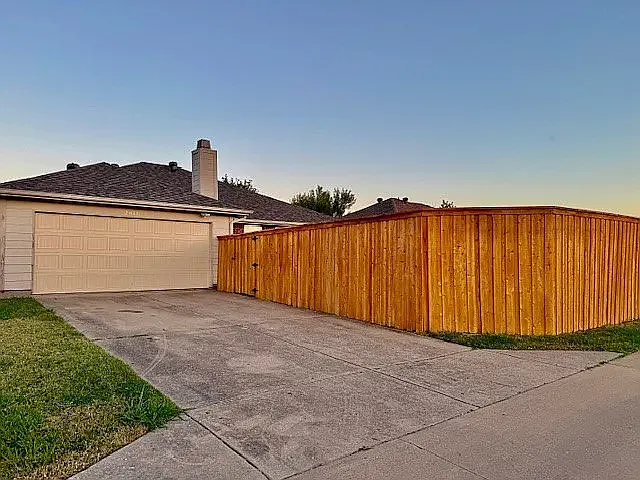 Alley entrance to garage and backyard