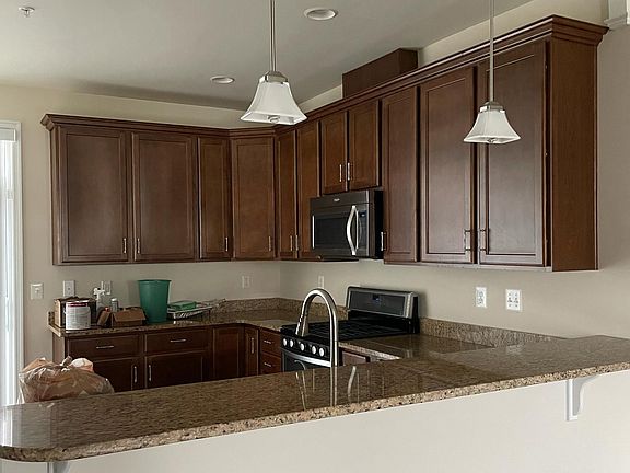 Kitchen: Granite Countertops, SS Appliance, Deck Access