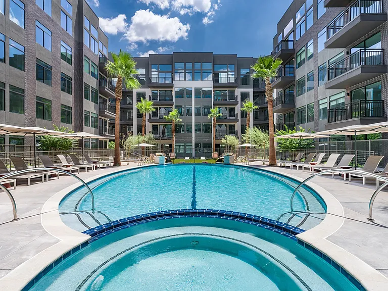 Cool off in the resort-style pool or take a relaxing soak in the spa, all surrounded by lush landscaping and stylish loungers.