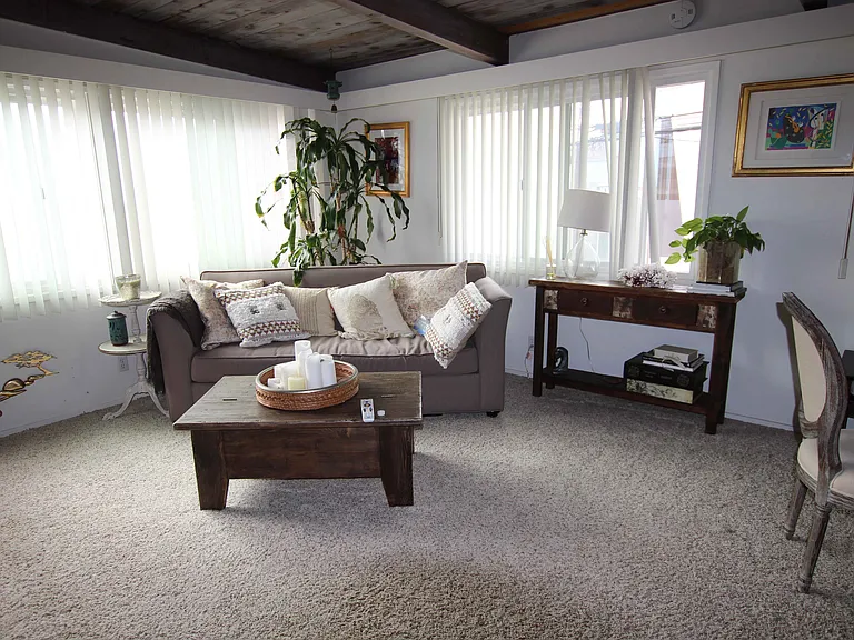 Archival image of the living room. Note, flooring has been updated.