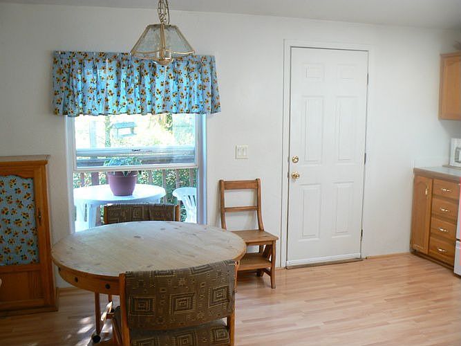 kitchen w/eating area & door to wrap around deck.