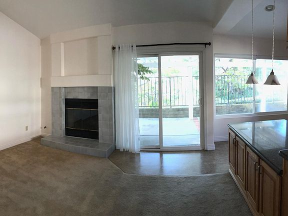 Kitchen and family room adjoining backyard patio with a view of sunsets.