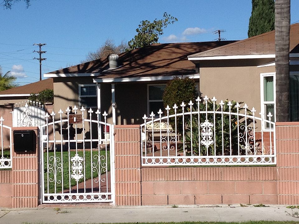 Gate with brick wall
