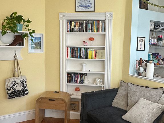 Built -in Bookcase in LR. Used to be secret passage from Frank Jones Suite to his wife's suite. This apartment was Martha Jones private suite.