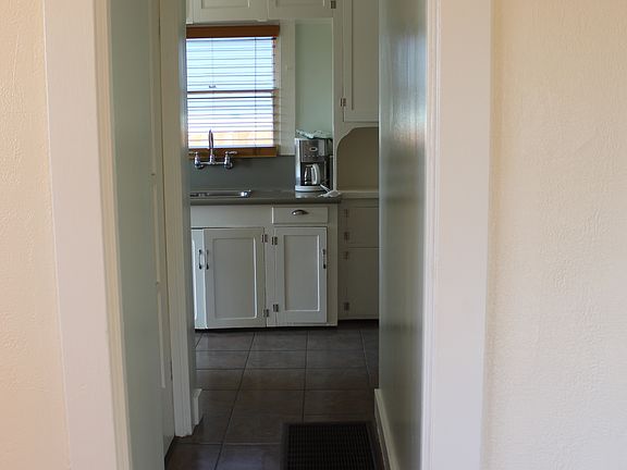 Hallway to bathroom and kitchen.