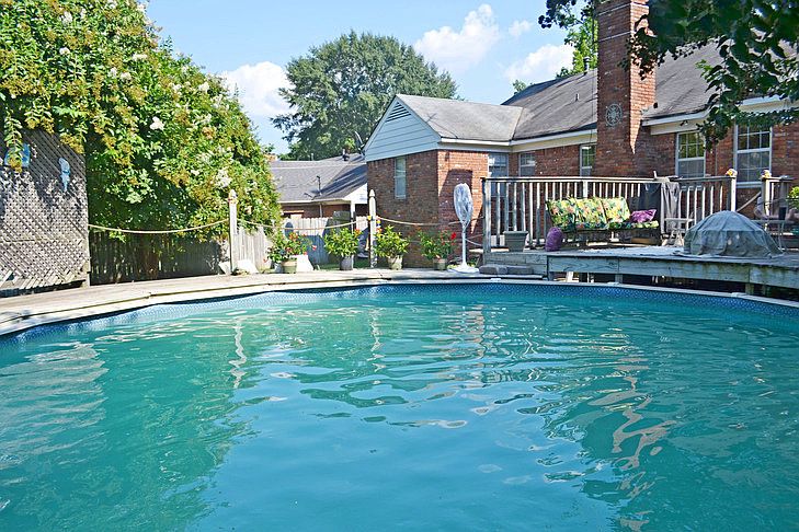 Above ground pool with custom wood deck