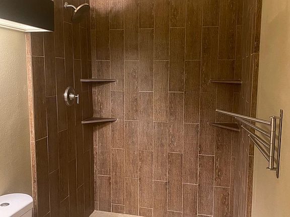 spa like shower with marble floor