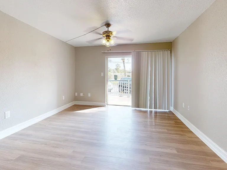 Enjoy this spacious living area with direct access to outdoor relaxation.