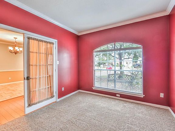 French door entry to this light filled room makes this an impressive private office located just off the main entry