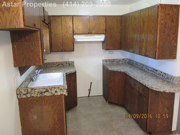 Kitchen with lots of cabinets.