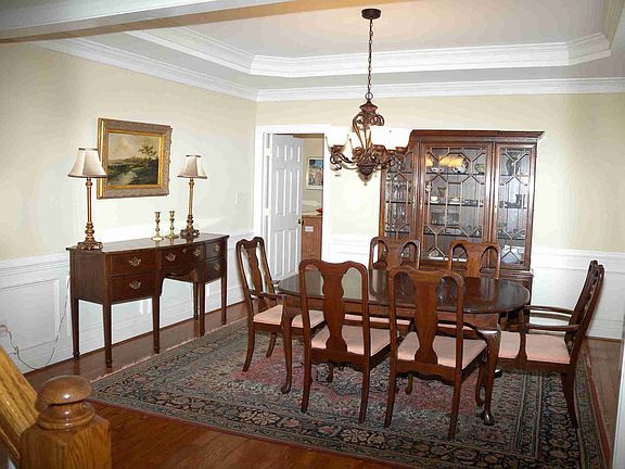 Beautiful Formal Living Room with tray ceiling and extensive moldings.