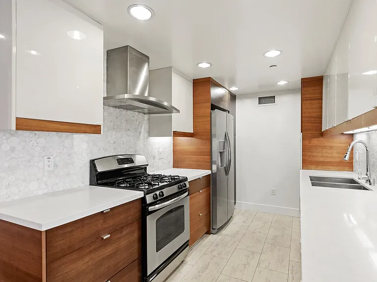 Full-Size Kitchen with Energy-Efficient Appliances, Ample Cabinet Storage, and Countertop Space