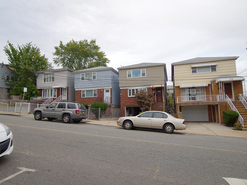 Front, blue house, second house on the right.